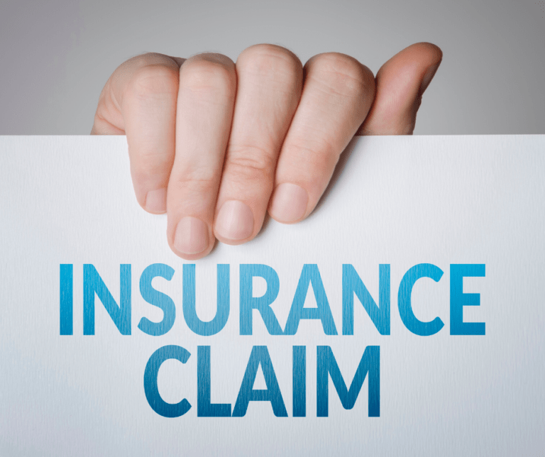 Shows hand with insurance claim sign