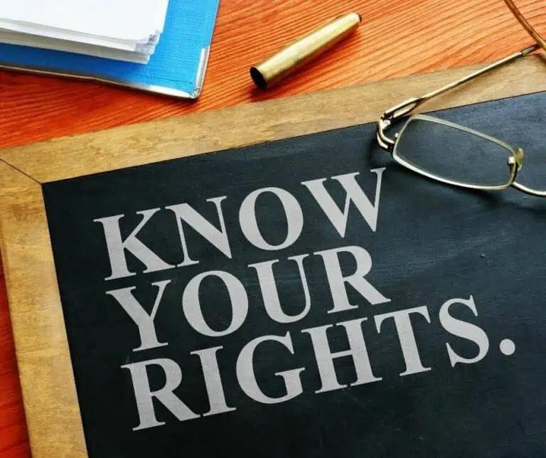 Black board on a desk, Trucker rights with insurance claims, Know your rights