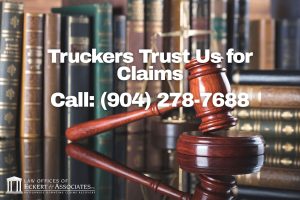 A judge’s gavel and legal books with overlaid text: "Truckers Trust Us for Claims. Call: (904) 278-7688. Law Offices of Eckert & Associates.