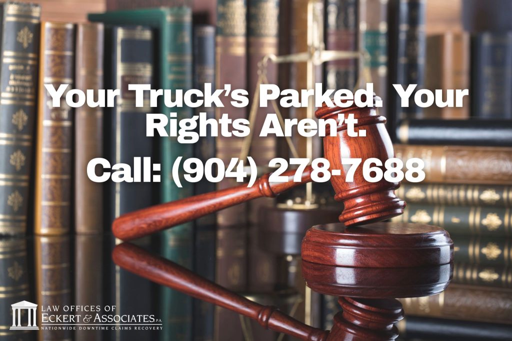 A wooden gavel rests on a desk with law books in the background; text reads, “Your Truck’s Parked. Your Rights Aren’t. Call: (904) 278-7688.”.